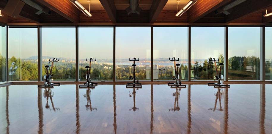 Stationary bikes in a studio overlooking the city and ocean at the Hollyburn Country Club in West Vancouver, British Columbia